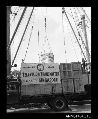 Photographic negative showing loading of the first AWA television transmitter for export to Singapore
