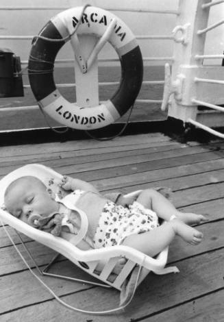 Photograph depicting a baby sleeping on ARCADIA's deck