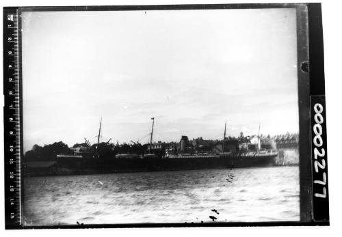 Steamship on Sydney Harbour with four masts, many derricks, and single funnel aft of the second mast