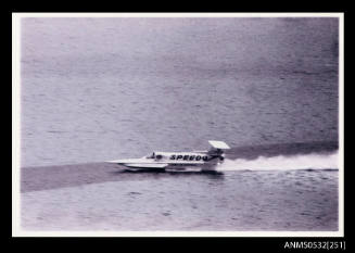 Port side view of SPIRIT OF AUSTRALIA under power on Blowering Dam