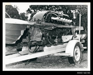 The port side view of the damaged hull of fibre-glass of racing boat MERLIN