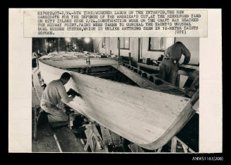 The the wooden hull of a racing yacht INTREPID under construction
