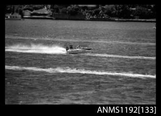 Black and white negative number 34A depicting MINI MERLIN at speed