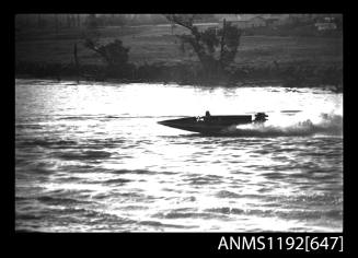 Black and white negative number 29A depicting view of QUICK-CAT with twin Chrysler outboard engines, at speed, port side view