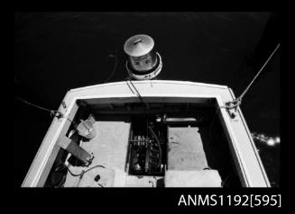 Black and white negative number 18 depicting view of stern cockpit showing steam engine and boiler