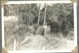 George Clark standing by a river