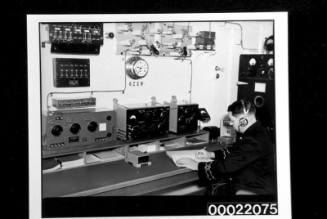 A wireless operator at work in the Marconi room of the ORCADES
