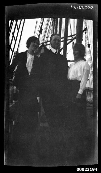 Man and two women on deck