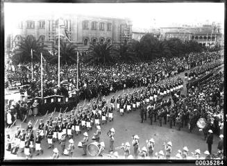 Royal Navy ratings marching with the Royal Marines Band Service marching in Sydney