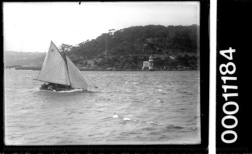 Yacht sailing near Bradley's Head light, Sydney Harbour