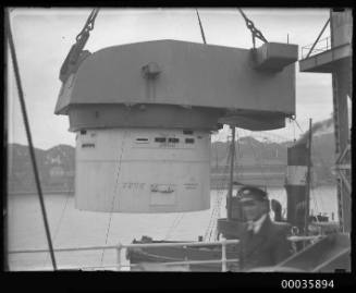 Titan crane loading gun turret to steamer.
