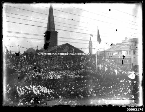 Rally with banner reading God Save the Queen