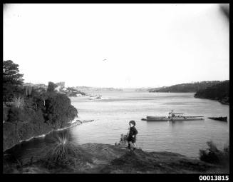 Boy with view of Darling Harbour from Berry's Bay