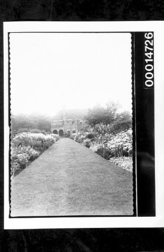 A garden in bloom at a large residence, England