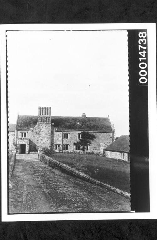 Driveway to a large stone building, England