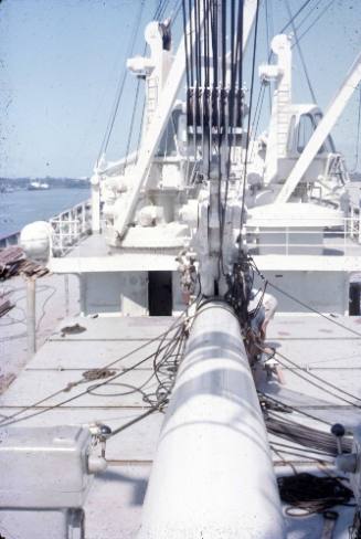 Slide depicting a large white metal pole at the center