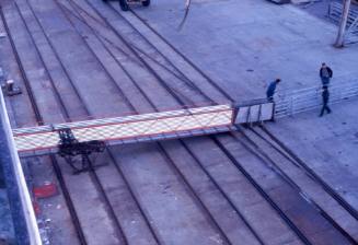 Slide depicting a raised platform that the sheep will run along to be loaded on a vessel