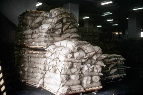 Slide depicting bags of produce unevenly stacked on pallets
