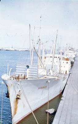 Slide depicting a ship docked at quay
